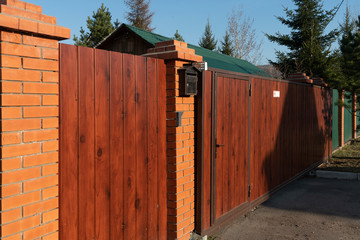 Wooden gate to a country house.