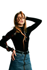 Beautiful woman in black bodywear and snake. Blonde model girl with fashion perfect make up.