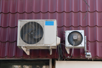 Air conditioning chillers on the roof of the building.