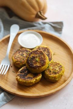 Delicious vegetable cutlets with sour cream on table