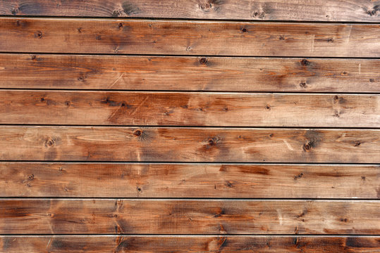 The surface is made of parallel boards. The texture of the processed wood.
