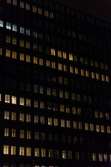 Obraz premium Office building at night with lighted windows in Amsterdam, Netherlands