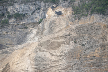 Rocky cliff with trees. Side view.