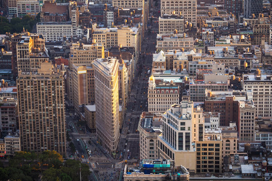 Aerial view of Manhattan including architectural landmark Flatiron Building in New York City, United States of America. - Powered by Adobe