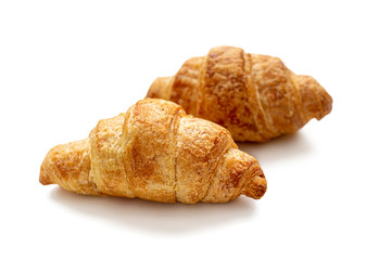 Traditional French croissants on a white background
