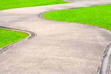 Obraz premium Walkway pathway curve in public garden, Bangkok Thailand.