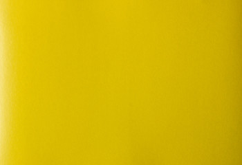 Bright colorful yellow color cardboard texture.