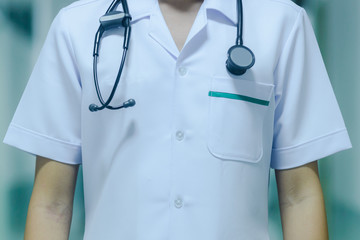 Close-up view of unidentified doctor wearing gown suit with stethoscope