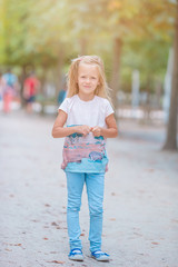 Adorable fashion little girl outdoors in European city