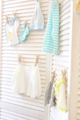 children's clothes hang on clothespins