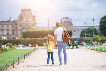 Family in European city, Paris, France. French summer holidays, travel and people concept.