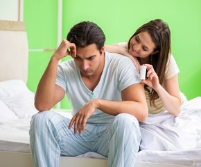 Man using pills for woman satisfaction