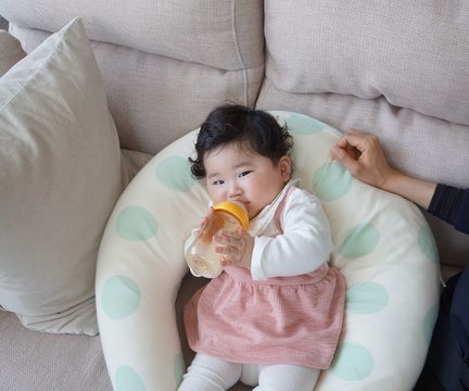 6 months old baby drinking milk. so cute.