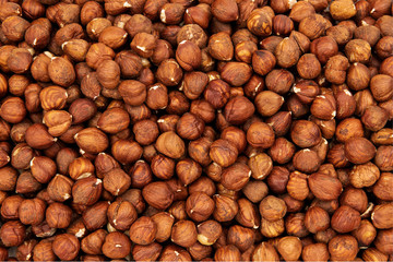 Heap of peeled hazelnuts as a background