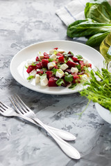 Baked beets with feta cheese and shoots of young peas