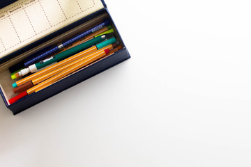 Pen case with notepad and stickers on a white background, mockup 