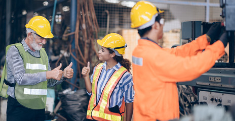 professional technician engineer and inspector thumbs up in factory