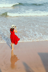 Woman taking photo  on beach