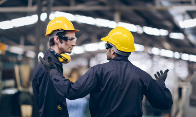 profession technician engineer and mentor talking to process  in factory