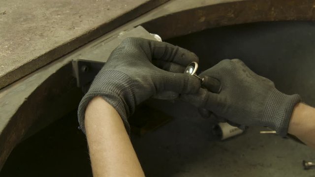 Goldsmith cleans golden wedding ring