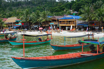 Fototapeta na wymiar traditional khmer boats on the beach of Koh Rong Island near Sihanoukville, Gulf of Thailand, Cambodia