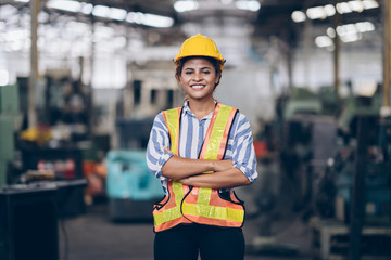 Smile technician engineer women arms cross  in factory