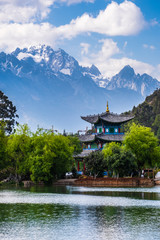 Fototapeta premium the black dragon pool in front of Jade dragon Snow Mountain the most beautiful snow mountain in Lijiang, Yunnan, China