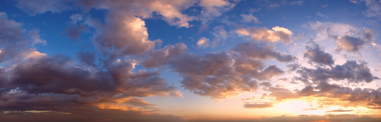 Sunset sky panorama with clouds