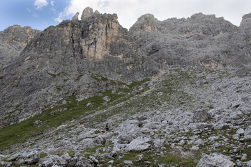 Woman's crossing via via ferrata in the alps