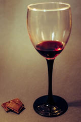 Glass of red wine on a dark background
