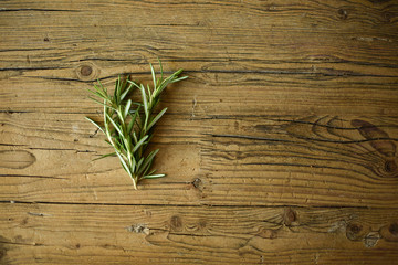 green leaves on wooden background