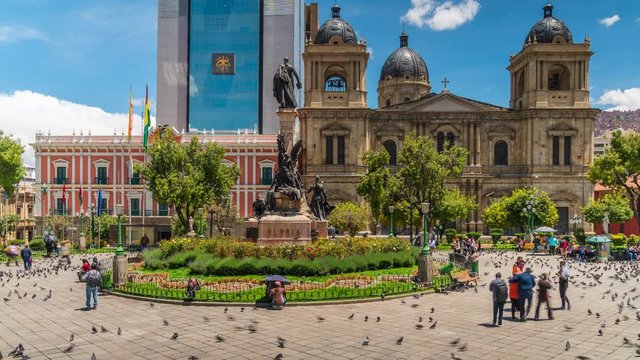 Zoom out time lapse view of Plaza Murillo showing historical landmarks Presidential Palace and La Paz Cathedral in central La Paz, Bolivia, South America.