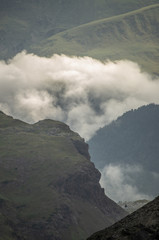 Mist seeping between the valleys. Mist sleeping between the valleys and the green mountains.