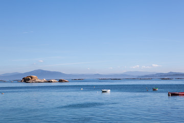 Stunning views of the oyster farms of Galicia Spain on a calm sunny day