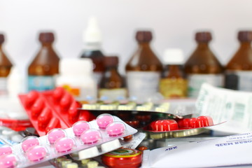Medical still life Medical preparations with tablets, capsules, alcohol, hydrogen peroxide, thermometer, vitamins, iodine, packages with medicines