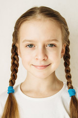 Portrait of a beautiful 9-10 years old girl with blond hair.