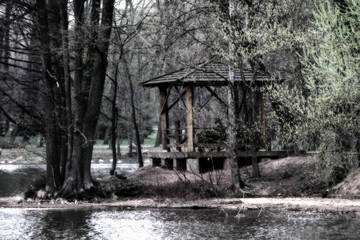 A swaying gazebo by the river in a fabulous gloomy style