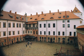 The courtyard of the Mir Castle in cloudy weather