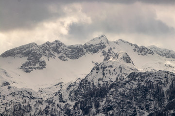 Fototapeta na wymiar Snow covered mountains in Bohinj