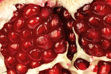 ripe juicy red pomegranate macro