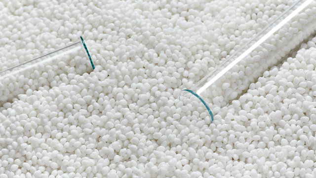 Closeup of a granule of white plastic polymer