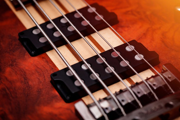 Fototapeta premium Brown Electric Bass Guitar. Close Up. Abstract Picture