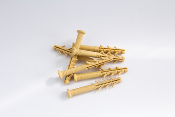 yellow dowels on a white background