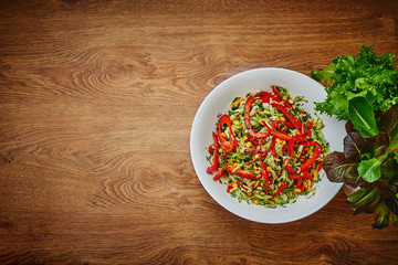 salad of peppers, cucumbers and corn on a dish