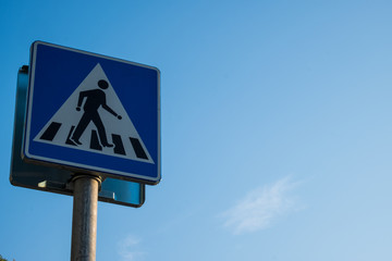 Cross sign with sky in background