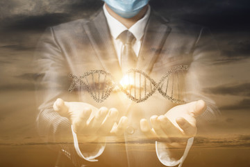 Young businessman in a mask shows a DNA molecule