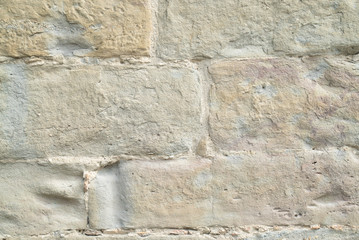 Natural stone wall texture. Medieval masonry. Ancient wall. Stone brick wall. Macro texture. Medieval architecture. Rough masonry. Background texture.