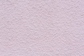 Texture of a painted light pink concrete wall. Abstract architectural background. external plaster.