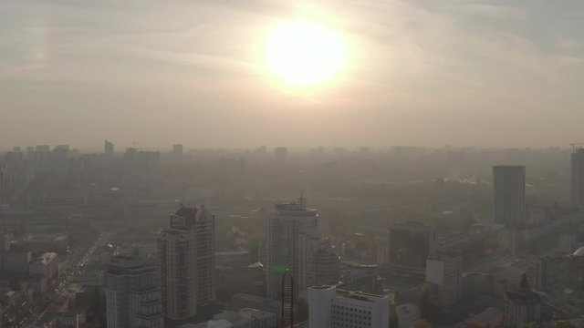 silhouette of a roof spire, lightning rod in a skyscraper. against the backdrop of sunset and evening city center