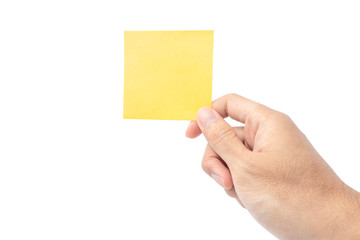 Fototapeta premium Close up hand holding empty yellow paper note isolated on white background with clipping path. remind to do list, office supplies note message, office and bussiness concept.